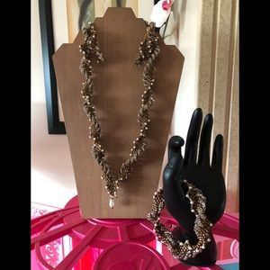 BROWN TWISTED TAIL BEADED NECKLACE.